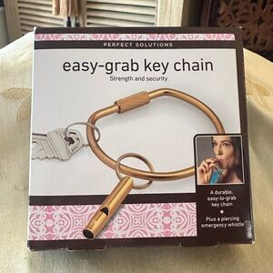 Perfect Solutions Gold Easy-Grab Key Chain Complete With Matching Whistle.